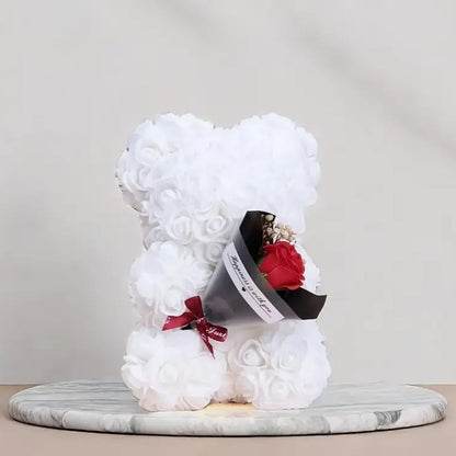 Rose bear with a bouquet of everlasting flowers