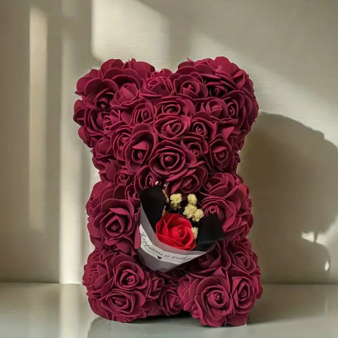 Rose bear with a bouquet of everlasting flowers